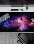 Dark space desk pad 40x20 inches in violet haze with electric blues and magenta clouds.