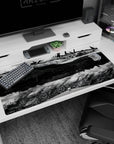 40x20 inches anime desk pad showing a massive battleship drifting overhead, engines exposed, smoke below.