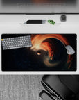 Dreamy deep-space mouse pad 32x16 inches in star-dusted navy and black with warm orange accents.