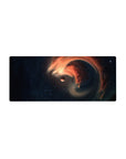 Deep space swirl nebula mouse pad 28x12 inches with navy stars, orange ribbons, and tiny planet.