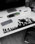 Roaring spined kaiju shattering a city skyline on an anime desk pad 36x16 inches.