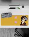 32x12 inches anime desk mat in warm orange with bold, cocky vibe and crisp black-red-gold accents.