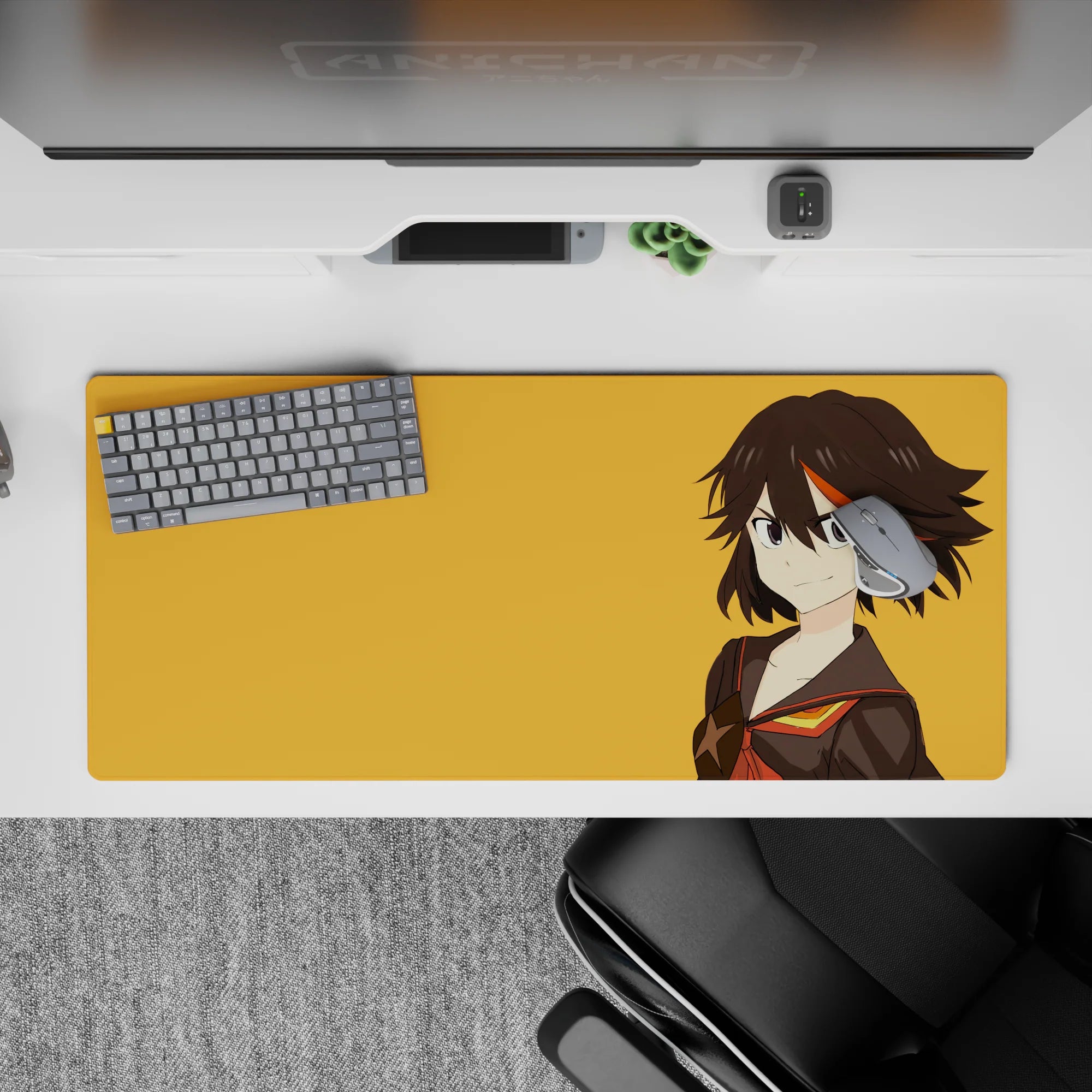Bold orange and black anime desk pad 36x16 inches, fiery red-gold trim and cocky gamer vibe.