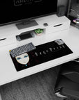 28x12 inches Ergo Proxy desk pad showing Re-L Mayer staring forward with sharp eyeliner against rainy alley vibes.