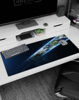 Planet Earth ribboning through dark space on a 36x16 inches desk pad mouse pad, with crisp clouds and stars.