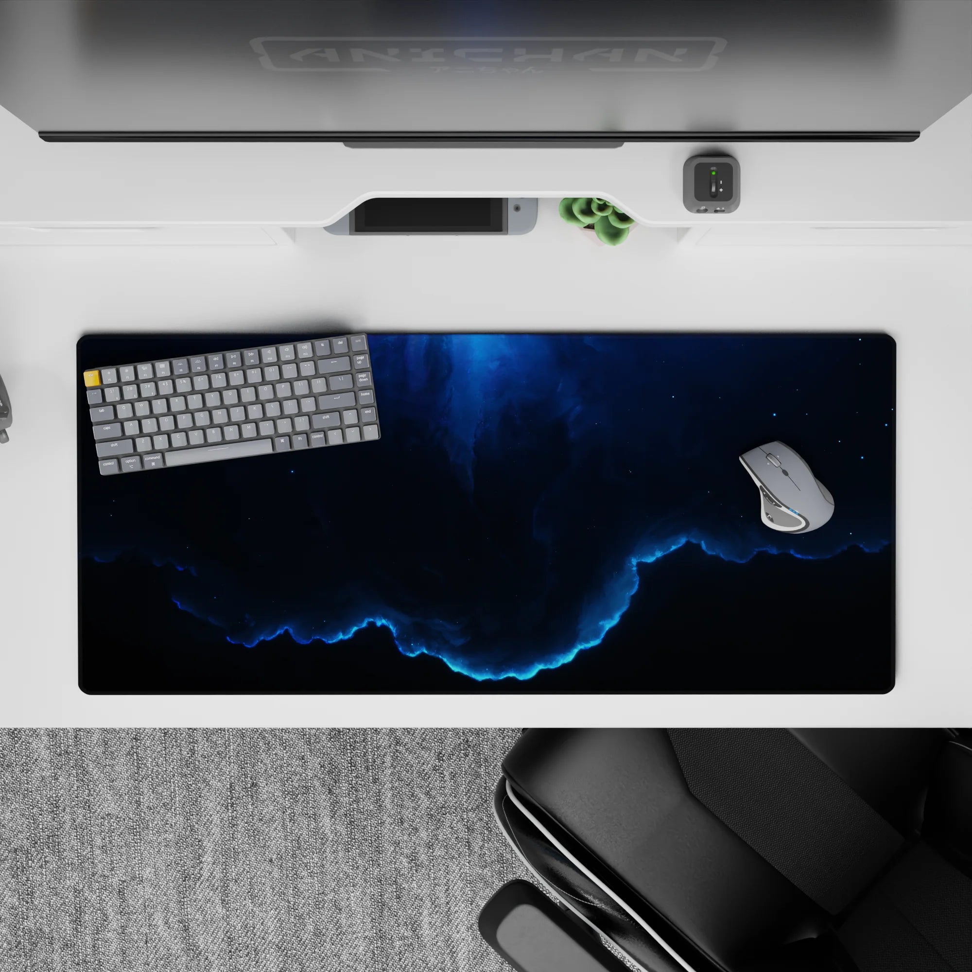 Moody deep navy and electric neon-blue glow desk pad 36x16 inches with calm cosmic gradient vibe.