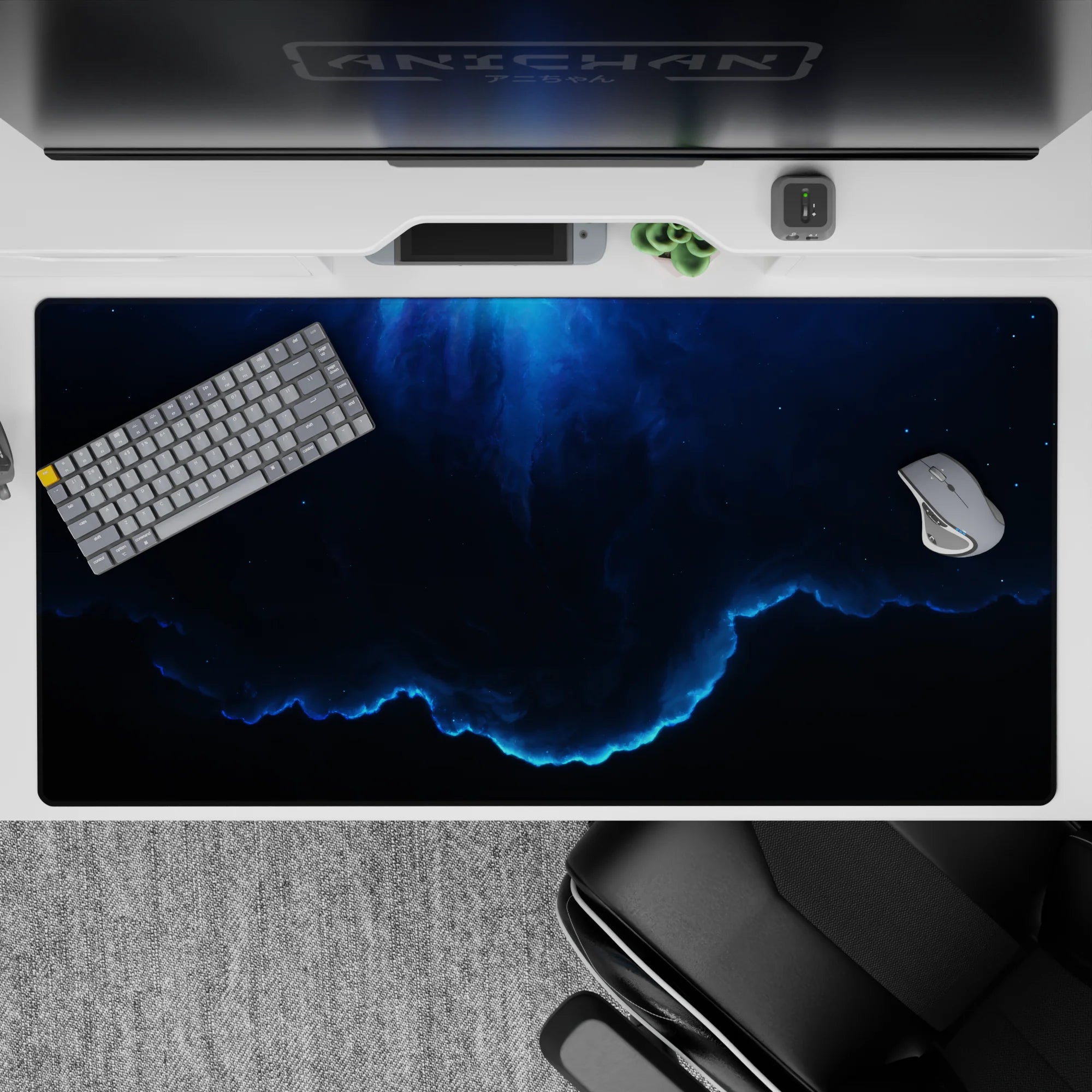 Moody deep navy desk pad 40x20 inches with smoky gradients, calm cosmic vibe, and electric blue edge glow.