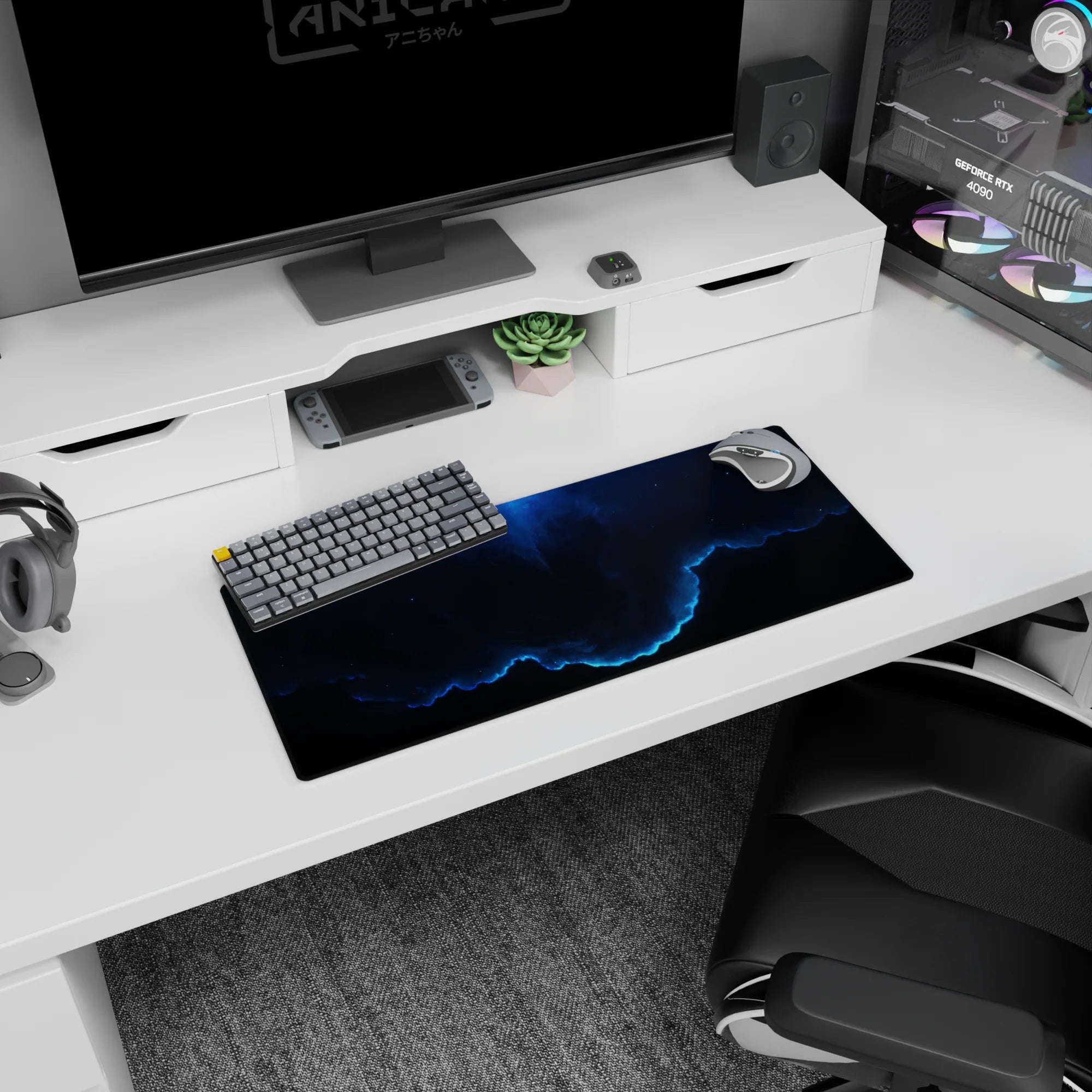 Neon-blue edge circling swirling night clouds and tiny stars on desk mouse pad, 28x12 inches.