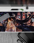 Albedo anime desk pad 40x20 inches, featuring her glowing golden eyes and black wings in a stunning stained-glass-lit scene.