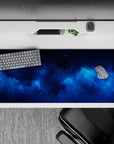 Deep navy and electric cloud desk pad 36x16 inches, calming cosmic mood with glittery star flecks.