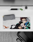 Tanjiro and Nezuko 28x12 inch Demon Slayer anime mouse pad, showcasing sibling bond and fierce protection amidst chaos.