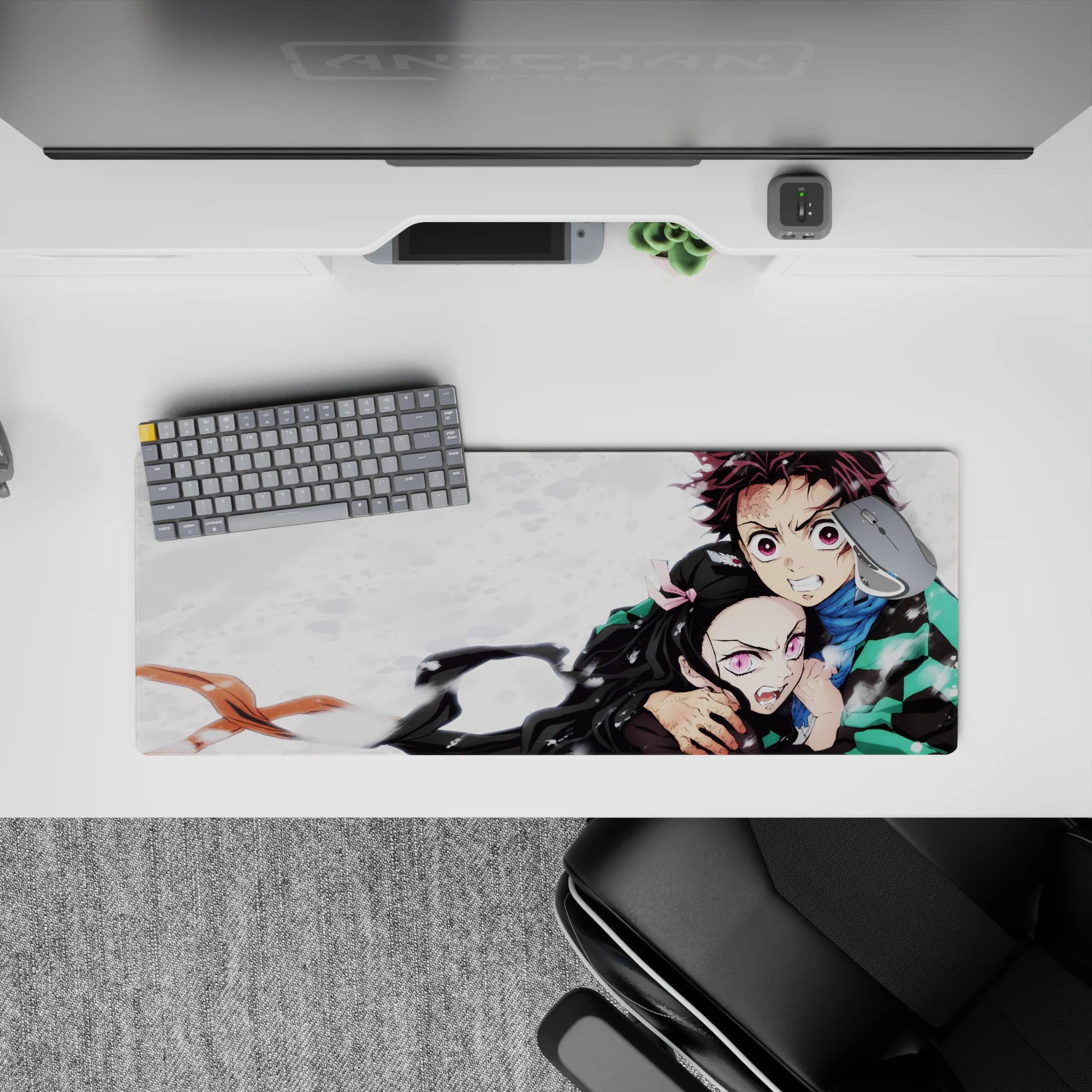 Tanjiro and Nezuko from Demon Slayer on a 32x12 inch anime mouse pad, showcasing their fierce bond and protective stance.
