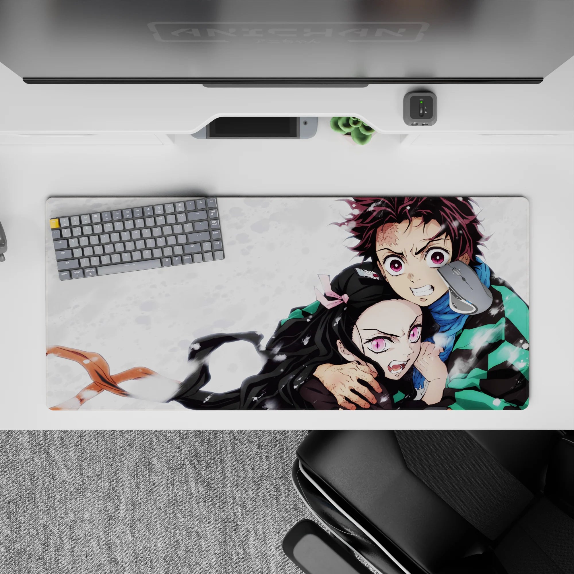 Tanjiro and Nezuko Demon Slayer desk pad 36x16 inches, showcasing fierce loyalty and sibling power against a snowy canvas.
