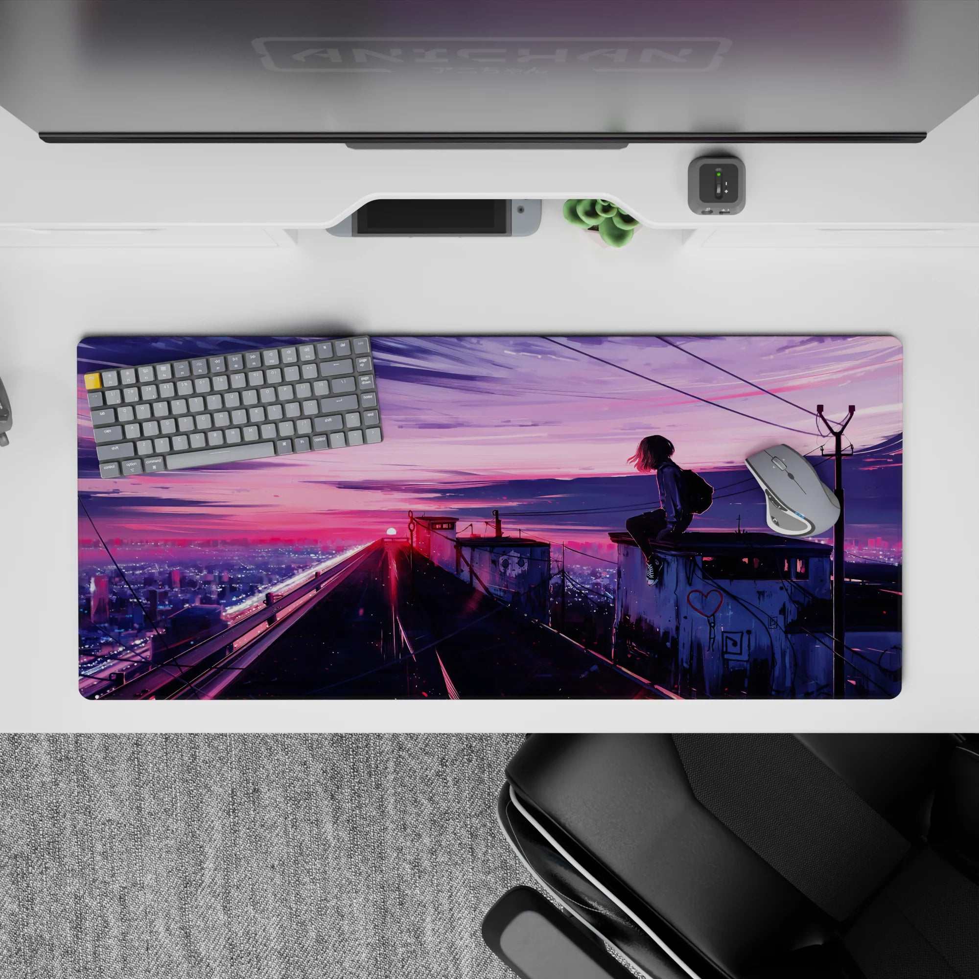 Cotton-candy neon pink and violet sunset desk pad 36x16 inches, calm late-night city glow vibe.