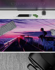 Neon pink to violet sunset mood anime desk pad 40x20 inches, calm late-night city glow.