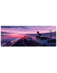 32x12 inches anime mouse pad with rooftop schoolgirl, city lights, power lines, and graffiti hearts at dusk.