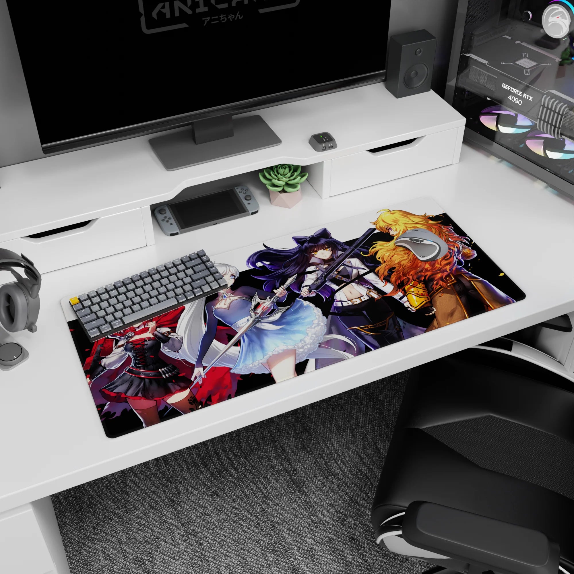 Ruby, Weiss, Blake, and Yang facing forward with angled weapons on clean white desk pad, 36x16 inches.