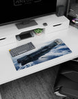 Sleek starship drifting above a cloudy blue planet desk pad, 28x12 inches.