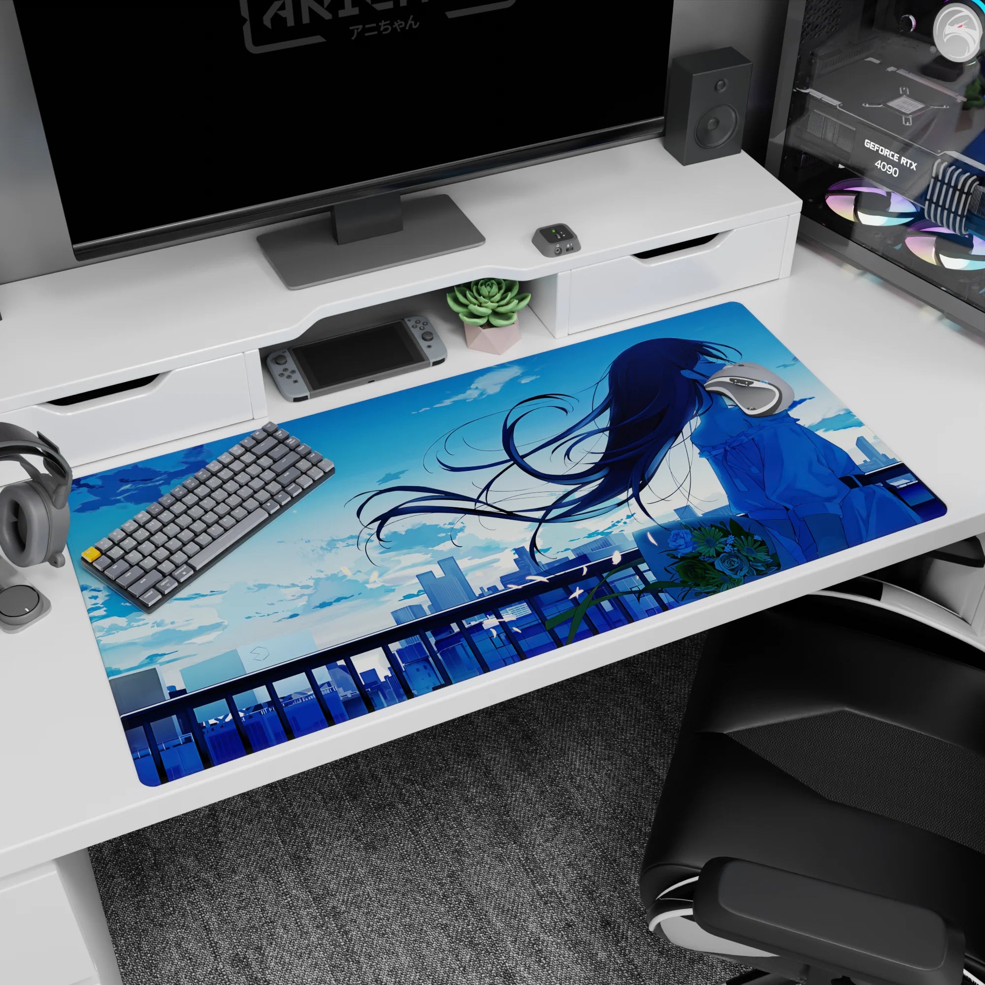 Long-haired anime girl watching the skyline at sunset desk pad 40x20 inches with breezy petal specks.