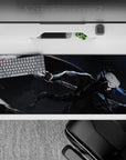 36x16 inches anime desk pad in stormy charcoal with silver flashes, red eyes, and electric blue accents.