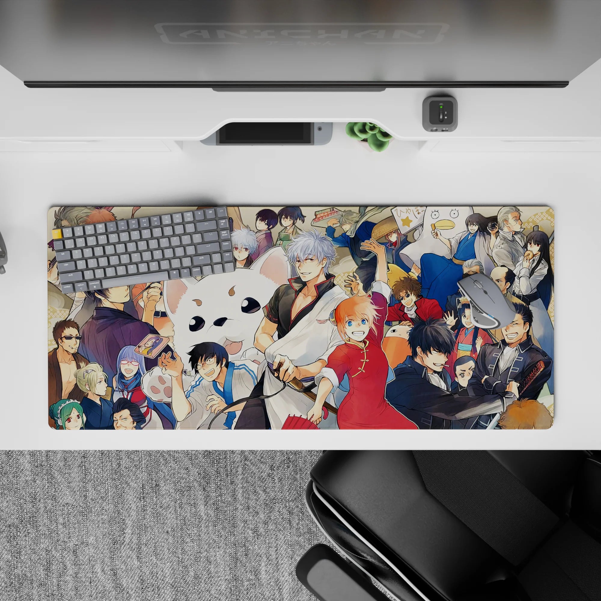 36x16 inches anime desk pad in bright reds and warm creams with slick blacks and blues, lively vibe.
