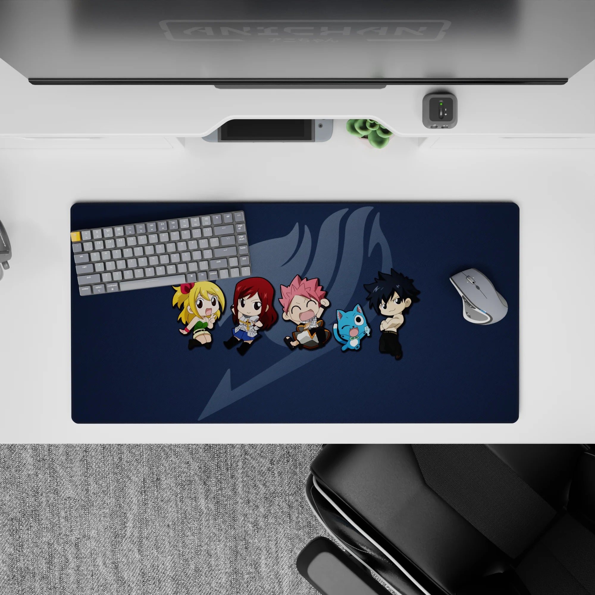Deep navy Fairy Tail desk mat with soft gray emblem and bright chibi colors, 32x16 inches.