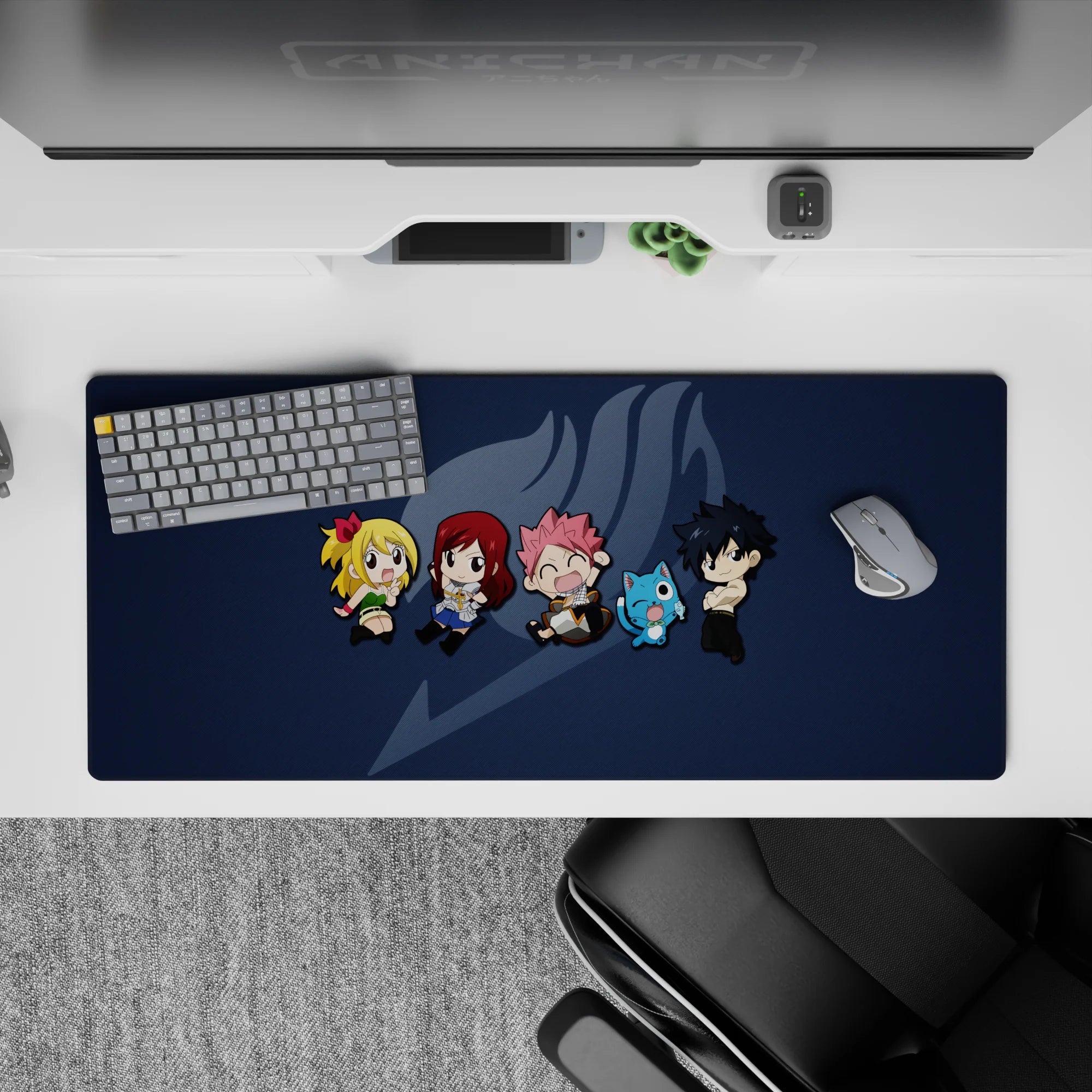 Deep navy 36x16 inches anime desk pad with soft gray emblem and bright chibi accents, fun vibe.