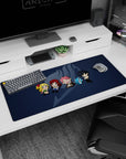 Lucy, Natsu, Erza, Happy and Gray chibi row on a 36x16 inches anime desk pad, navy backdrop.