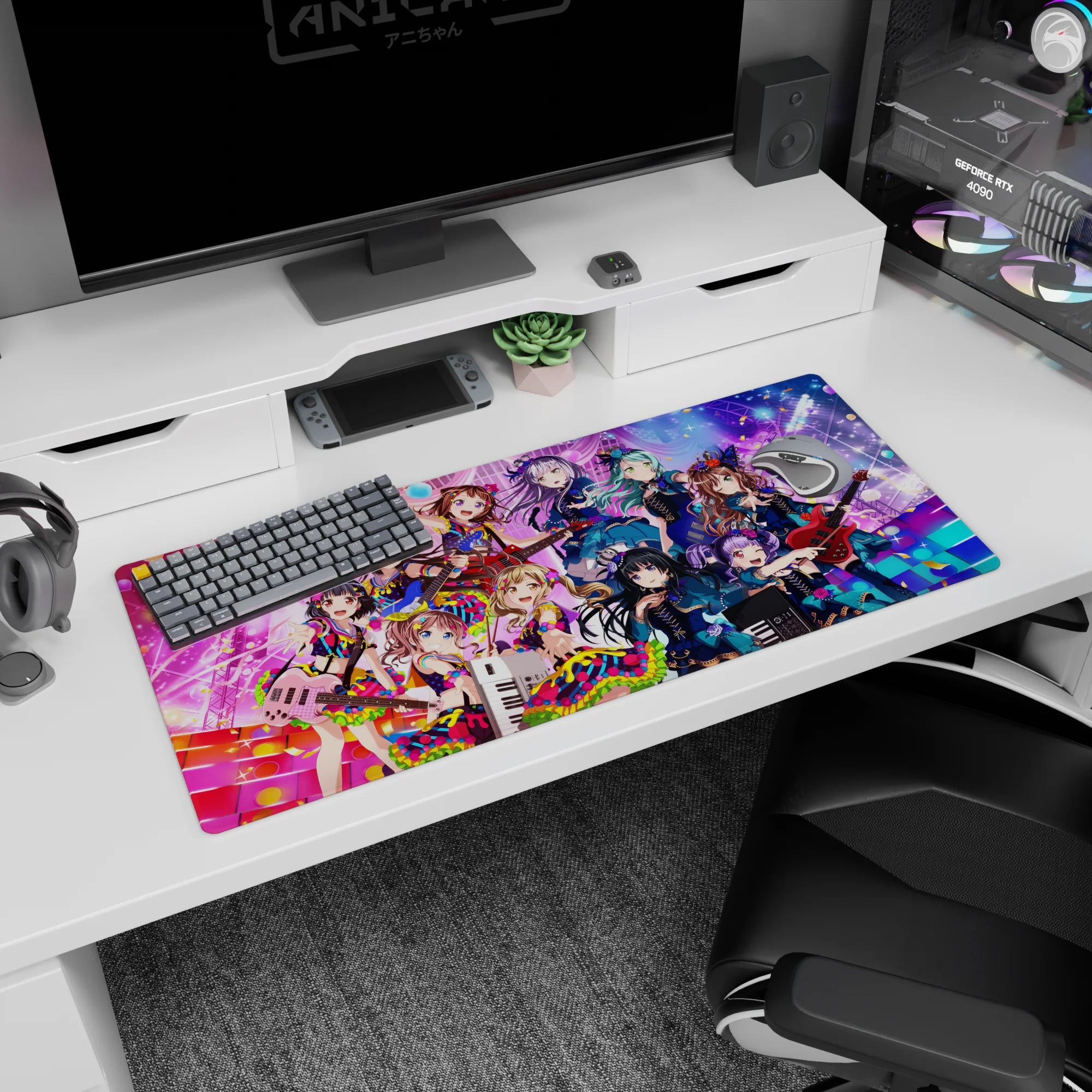 36x16 inches desk pad showing wide-eyed anime idol girl winking on stage with keytar and confetti.