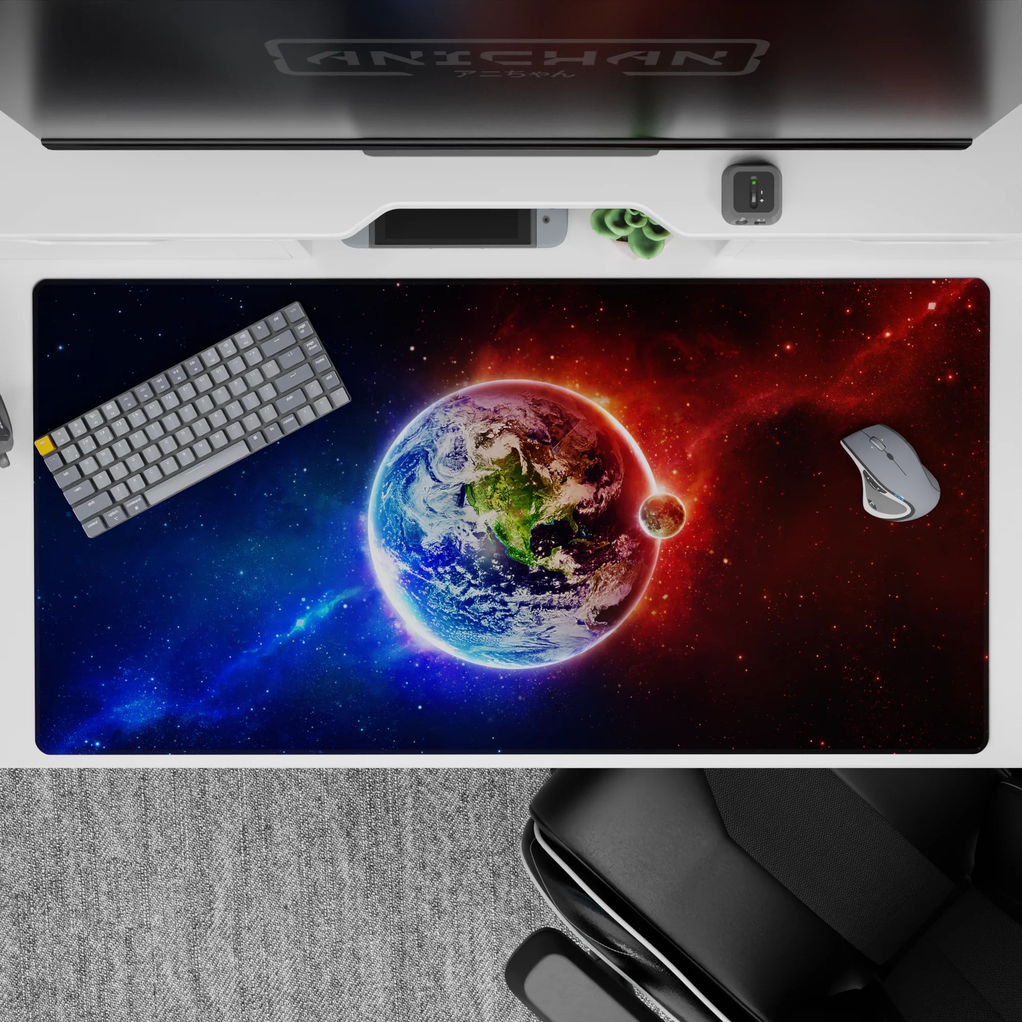 Cosmic gradient desk pad 40x20 inches in deep blues fading to fiery reds with starry haze ambiance.