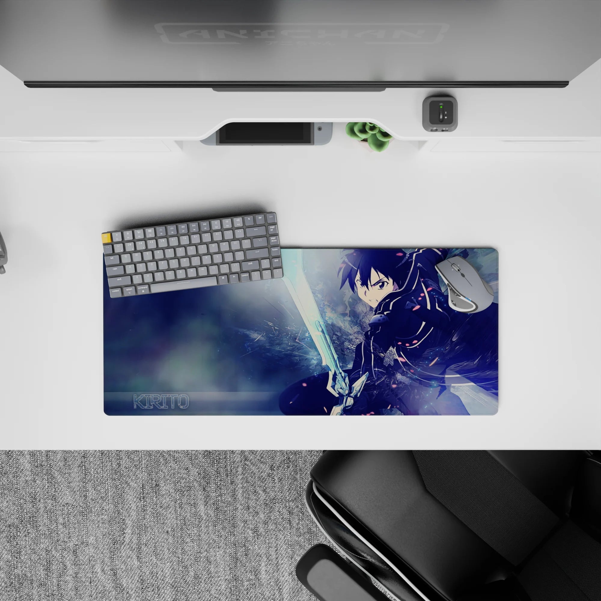 Anime mouse pad 28x12 inches featuring Kirito from Sword Art Online, in an intense, dynamic pose with icy blue tones.