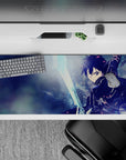 Anime desk pad featuring Kirito from Sword Art Online, 36x16 inches. Dynamic icy blues and electric glints capture action.