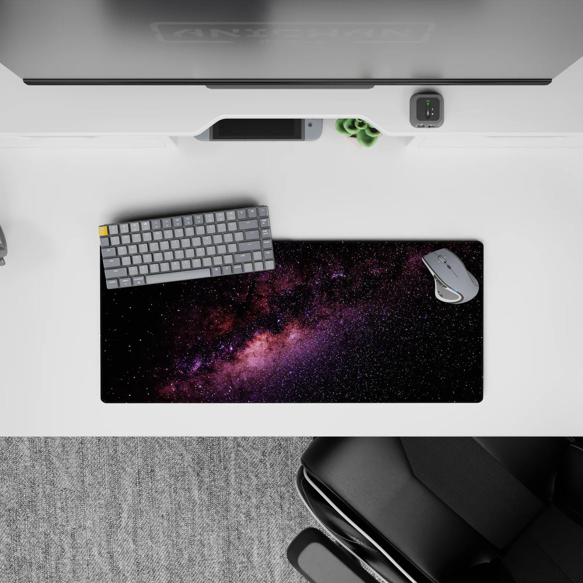 Calming black, purple and blush nebula mouse pad 28x12 inches with speckled stars for smooth tracking.
