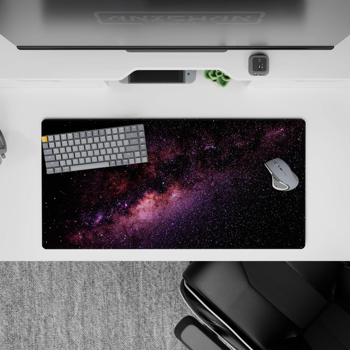 Calming inky black mouse pad 32x16 inches with purple and blush nebula glow and scattered stars.