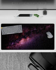 Calming inky black mouse pad 32x16 inches with purple and blush nebula glow and scattered stars.