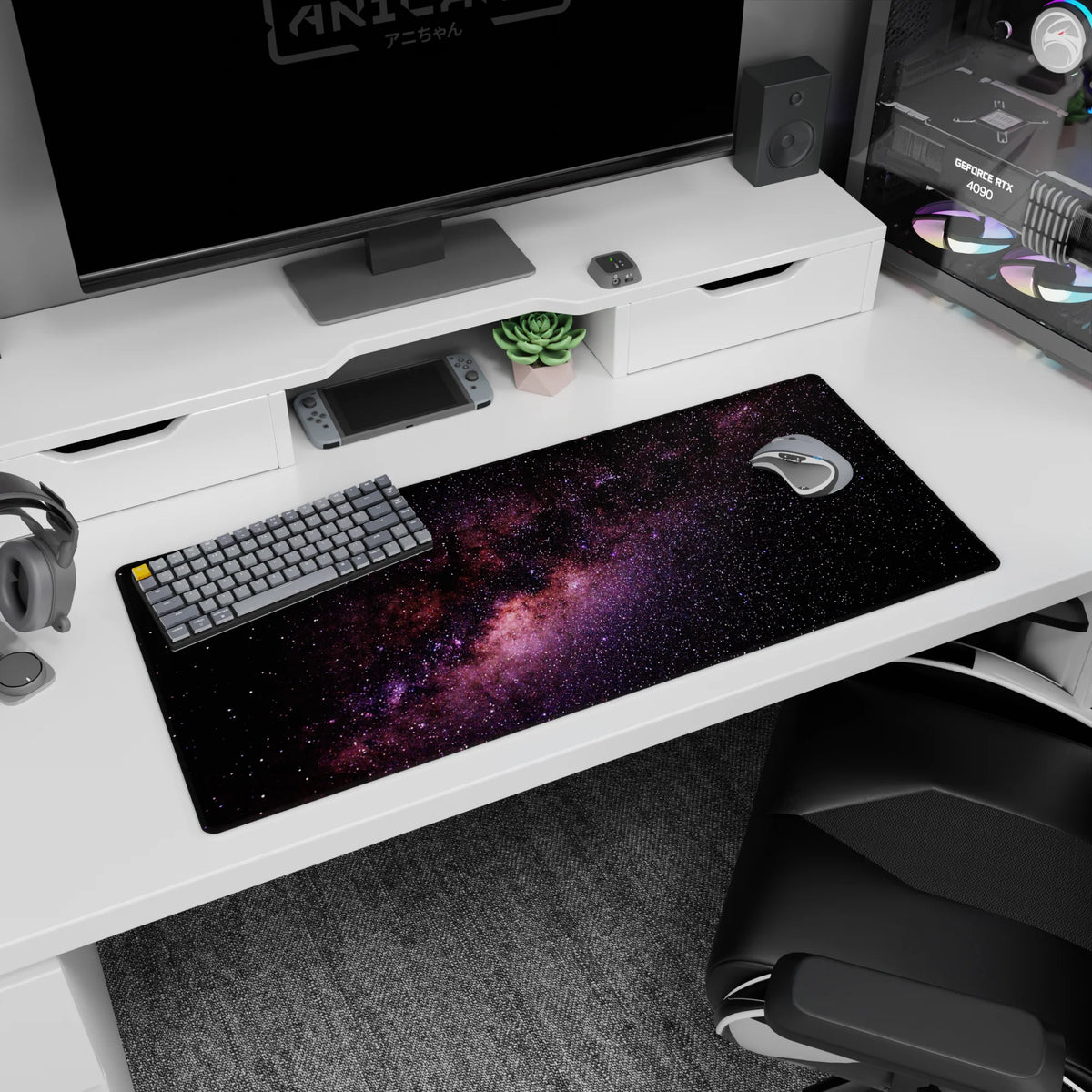 Starfield space scene desk pad 36x16 inches featuring a ribbon-like nebula across a black sky.