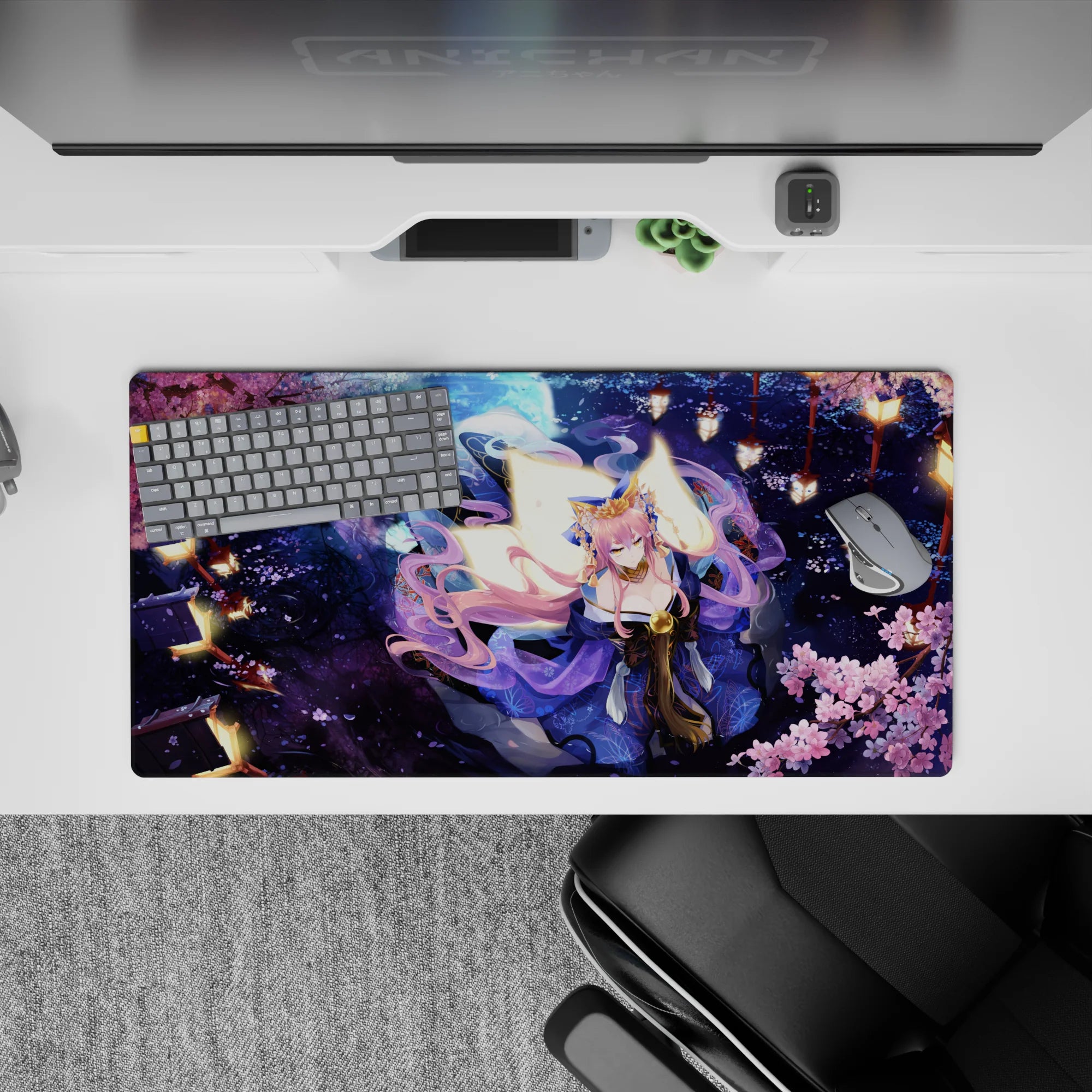 32x16 inches desk mat in midnight blue and pink, cozy dramatic lantern glow with shimmering purple petals.