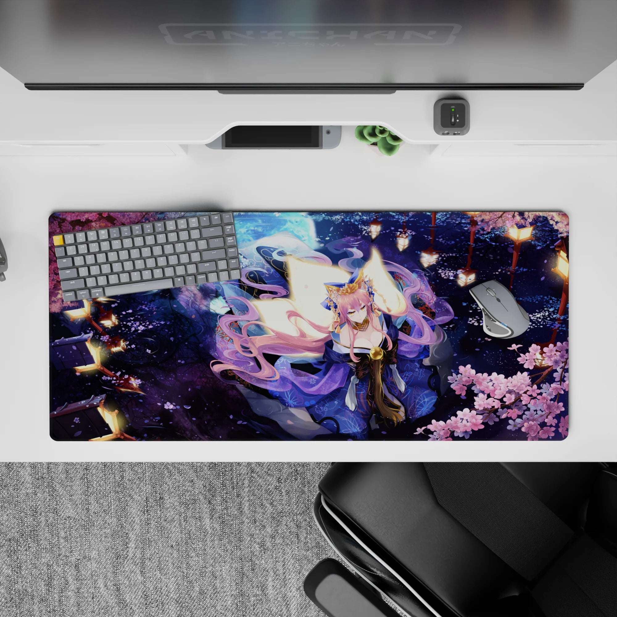 36x16 inches desk pad in deep midnight blue and pink with gold highlights, cozy dramatic lantern glow.