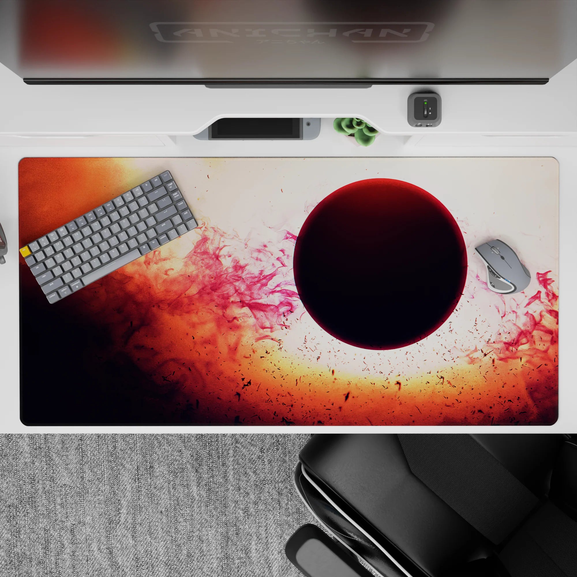 Cinematic space mood desk pad 40x20 inches in warm orange, smoky red, and soft pink wisps.