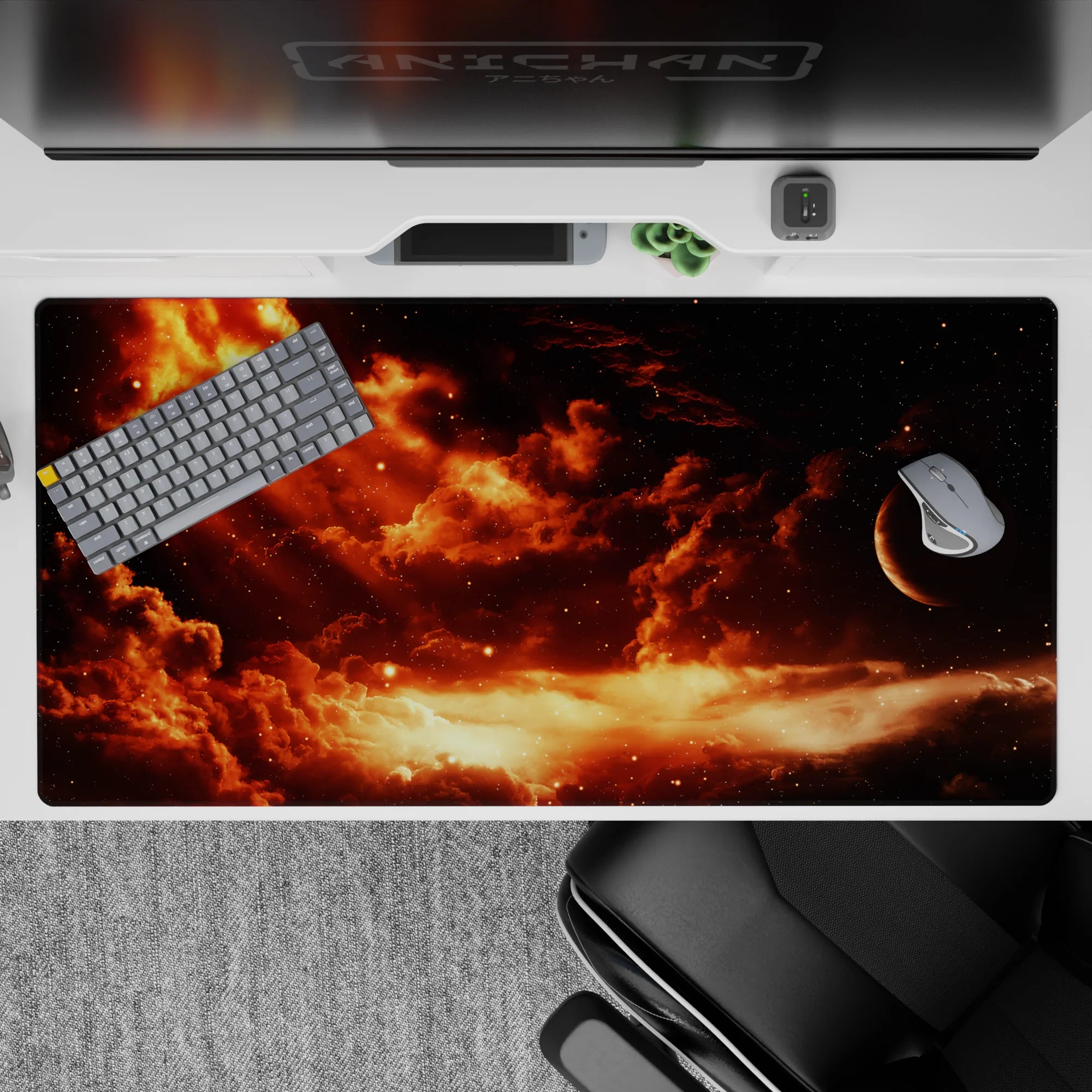 Warm orange and smoky brown sunset-in-space desk pad with soft glow pockets, 40x20 inches.
