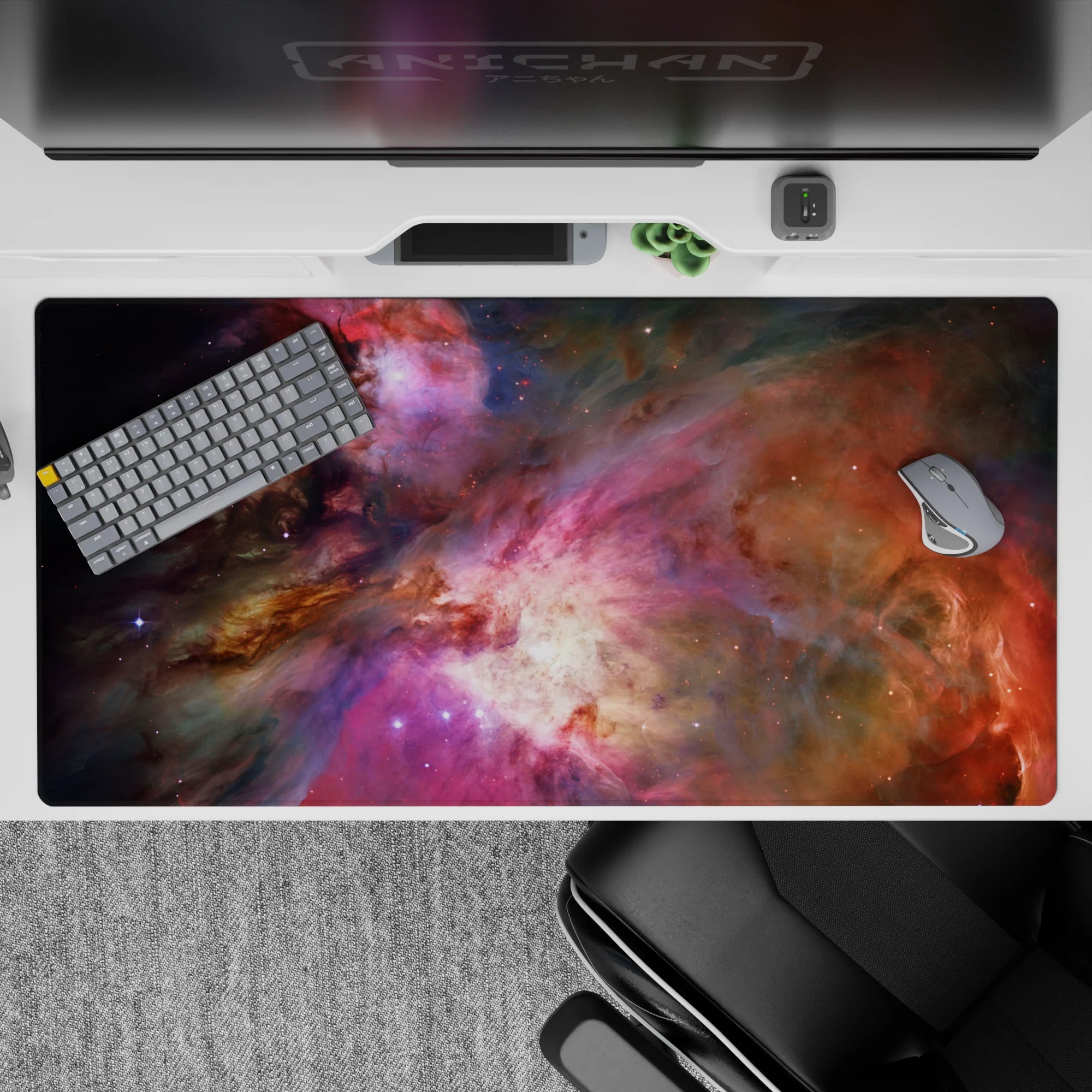 Dreamy space mood desk pad 40x20 inches in smoky purples, warm oranges, and soft starlight.