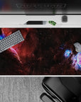 Warm red-brown clouds with icy blue and violet accents, calm late-night desk pad 40x20 inches.