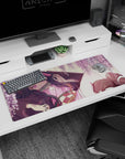 Nezuko from Demon Slayer on 36x16 inch desk pad under wisteria blooms, creating a serene, magical spring atmosphere.