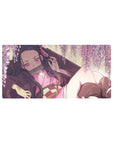 Nezuko from Demon Slayer on a 32x16 inch mouse pad under wisteria, surrounded by pink blooms, creating a serene atmosphere.