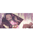 Nezuko from Demon Slayer under wisteria on a 36x16 inch anime desk pad, surrounded by blush-pink blooms and golden light.