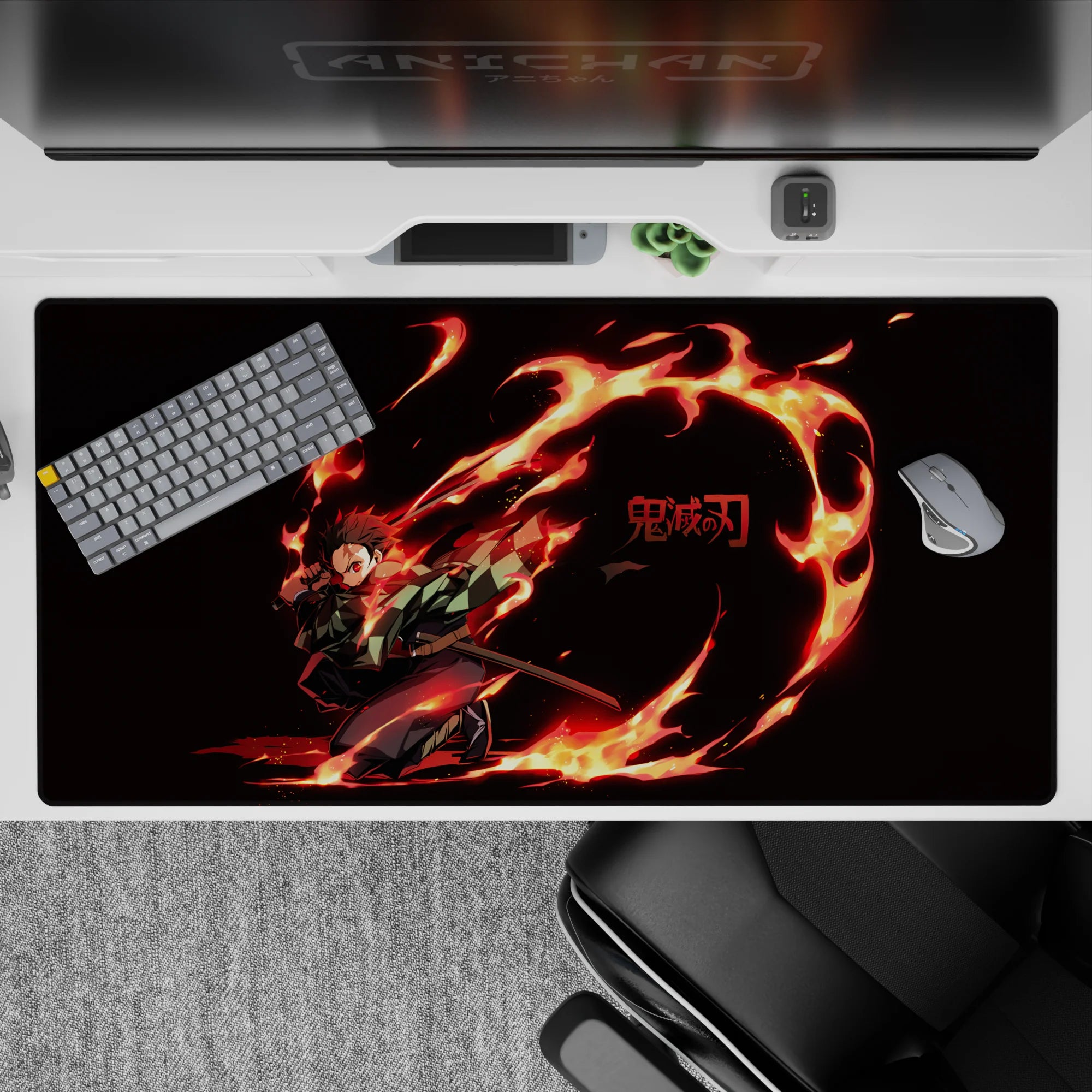 Tanjiro from Demon Slayer on a 40x20 inch anime desk pad, featuring vivid flames and intense colors for a striking effect.