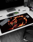 Tanjiro from Demon Slayer on a fiery 40x20 inches anime desk pad, vivid reds and oranges against a deep black background.