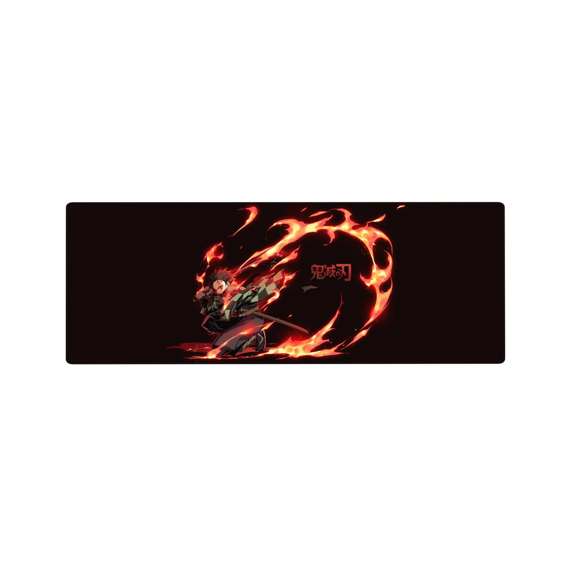 Tanjiro in fiery action on a 32x12 inch Demon Slayer anime mouse pad, showcasing vivid reds and oranges against a deep black background.