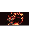Tanjiro from Demon Slayer bursts into action on a 36x16 inch desk pad, vibrant with fiery oranges and reds against deep black.