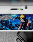 Moonlit blue anime desk pad 36x16 inches with bright orange-gold hair pops and fast-action vibe.